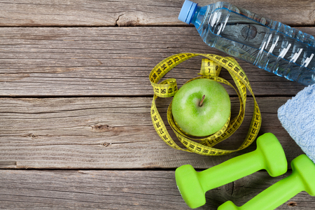 Dumbbells, water bottle and tape measure. Top view with copy spaceの写真素材