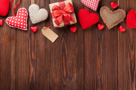 Valentines day background with handmaded hearts and candies over wood. Top view with copy spaceの写真素材