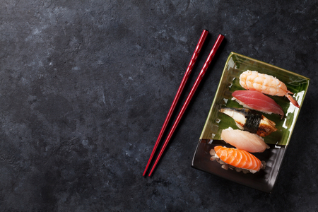 Set of sushi on stone table. Top view with copy spaceの写真素材