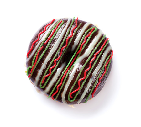 Chocolate donut with colorful decor. Isolated on white backgroundの写真素材