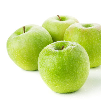 Four ripe green apples. Closeup. Isolated on whiteの写真素材