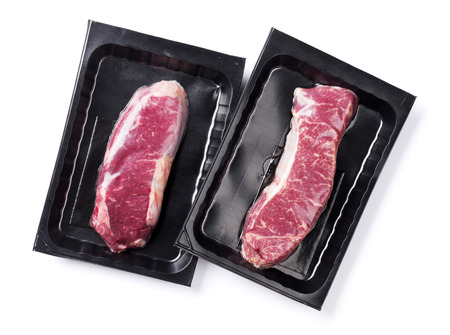 Raw striploin steak. Isolated on white backgroundの写真素材