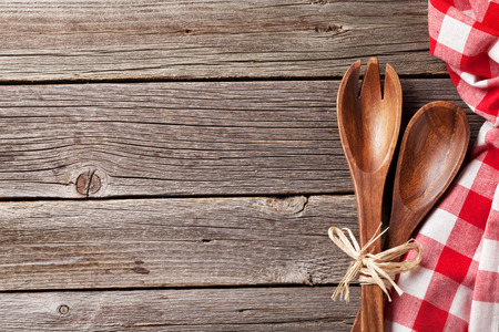 Kitchen cooking utensils over wooden table background. Top view with copy spaceの写真素材