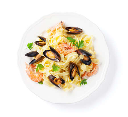 Pasta with seafood. Mussels and prawns. Isolated on white background. Top viewの写真素材