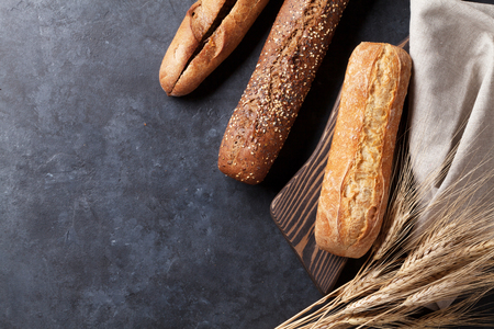 Mixed breads on stone table. Top view with copy spaceの写真素材