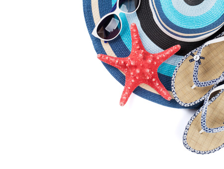 Beach accessories. Flip flops, hat, sunglasses and starfish. Isolated on white background. Top viewの写真素材