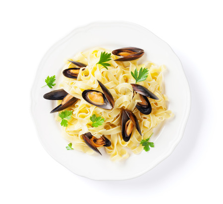 Pasta with seafood. Mussels. Isolated on white background. Top viewの写真素材