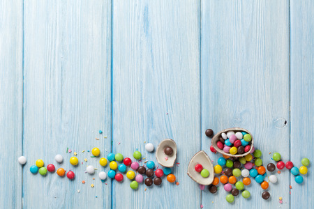 Colorful candies on wooden table background. Top view with copy spaceの写真素材