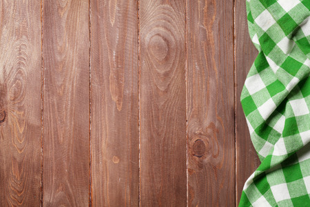Towel over wooden kitchen cooking table. Top view with copy spaceの写真素材