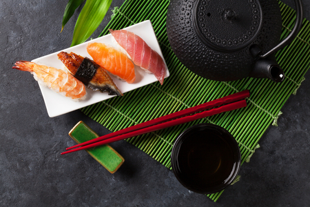 Set of sushi and green tea on stone table. Top viewの写真素材