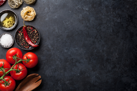 Cooking ingredients and utensils on stone table. Top view with space for your recipeの写真素材