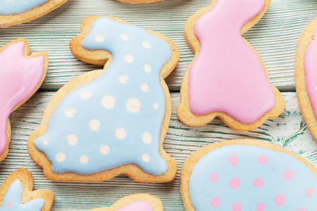Easter gingerbread cookies on wooden table. Eggs and rabbits. Top viewの写真素材