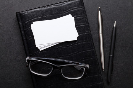 Office desk with supplies. Blank business cards. Top view with space for your textの写真素材