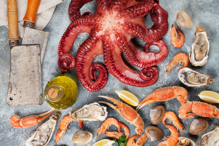 Seafood. Octopus, oysters, lobster, shrimps, clams cooking. Top viewの写真素材