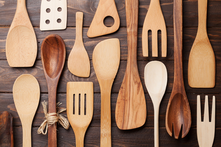 Various cooking utensils over wooden kitchen table. Top viewの写真素材