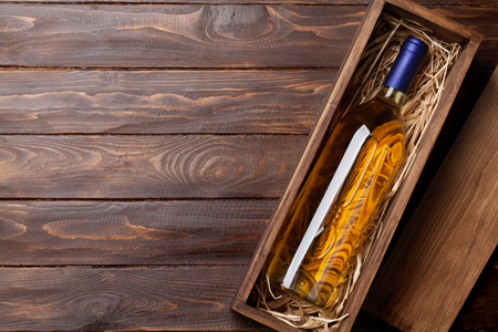 White wine bottle in box. Top view with space for your textの写真素材