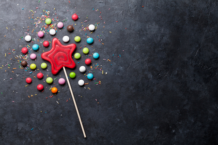 Colorful sweets. Lollipop and candies. Top view with space for your greetingsの写真素材