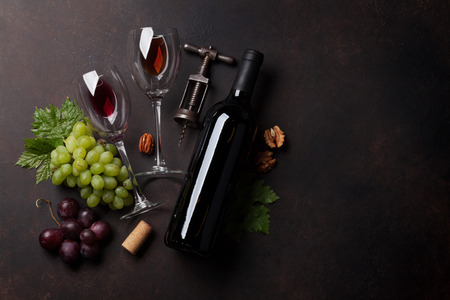 Wine, grape and nuts. Top view with space for your text