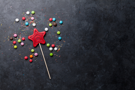 Colorful sweets. Lollipop and candies. Top view with space for your textの写真素材