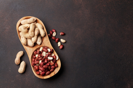 Peanut nuts in bowl. Top view with space for your textの写真素材
