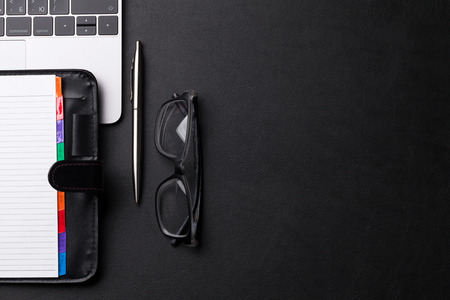Office workplace table with supplies and laptop. Flat lay. Top view with space for your text