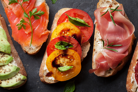 Brushetta or traditional spanish tapas. Appetizers italian antipasti snacks set. Top view and flat layの写真素材