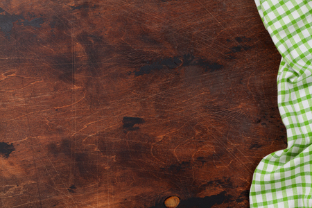 Cooking wooden table with kitchen towel or napkin. Top view with space for your meal or recipeの写真素材