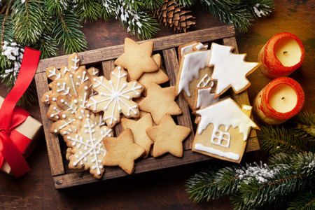 Christmas greeting card with gingerbread cookies and xmas gift box. Top viewの写真素材