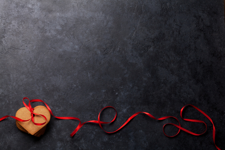 Valentine's day greeting card with heart shaped cookies on stone background. Top view with space for your greetings. Flat layの写真素材