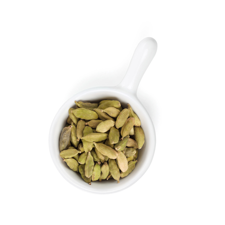 Green cardamom spice. Isolated on white backgroundの写真素材