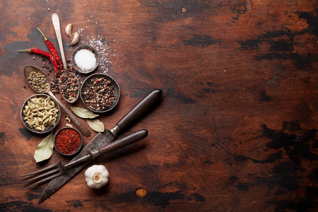 Set of various spices and herbs on wooden background. Top view with space for your recipe. Flat layの写真素材