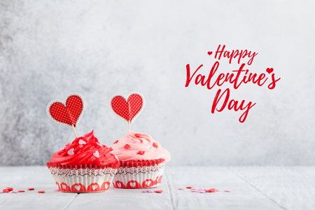 Valentine's day greeting card with delicious sweet cupcakes. With space for your greetingsの写真素材