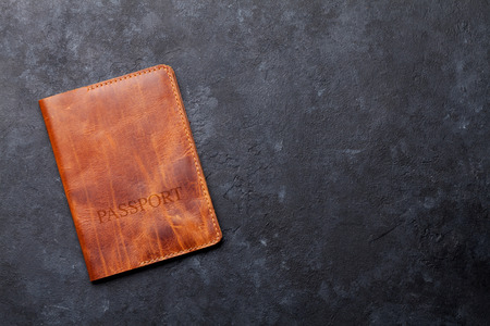 Travel vacation concept. Passport on stone backdrop. Top view with copy space. Flat layの写真素材