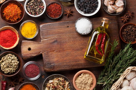 Set of various spices and herbs on wooden background. Top view with space for your recipe. Flat layの写真素材