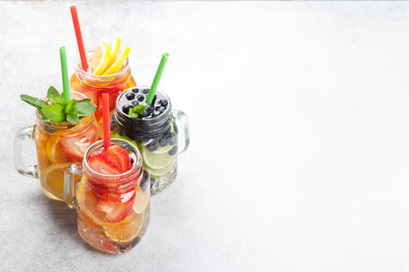 Fresh lemonade jar with summer fruits and berries. With space for your textの写真素材