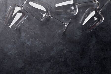 Wine glasses on stone table. Top view flat lay with copy space for your textの写真素材