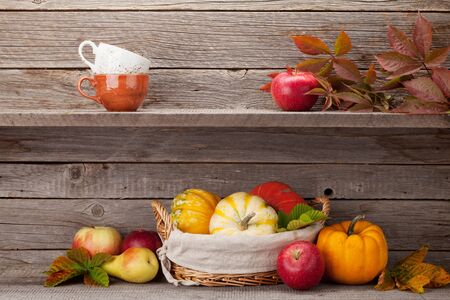 Autumn still life with pumpkins, apples, pears and colorful leaves. With space for your textの写真素材
