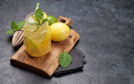 Fresh summer citrus lemonade with lemon, lime, orange and mint. With copy space for textの写真素材