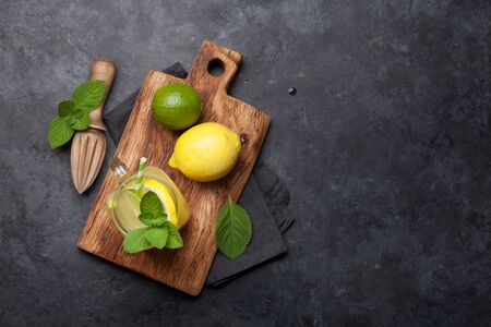 Fresh summer citrus lemonade with lemon, lime, orange and mint. Top view flat lay with copy space for your textの写真素材