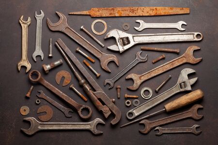 Vintage old tools on stone backdrop. Top view. Flat lay