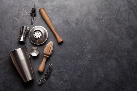 Cocktail utensils. Set of bar tools on stone table. Top view flat lay with copy spaceの写真素材