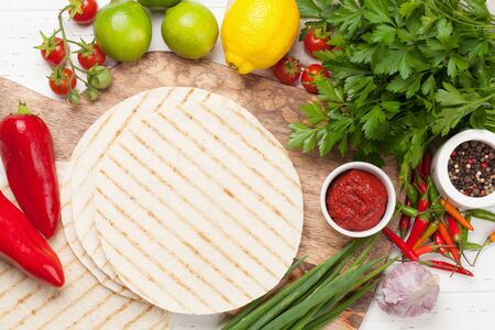 Mexican tacos with meat and vegetables cooking and ingredientsの写真素材