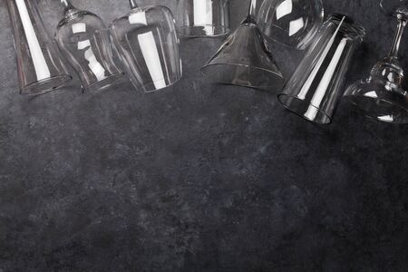 Set of cocktail glasses on stone background. Top view with copy space