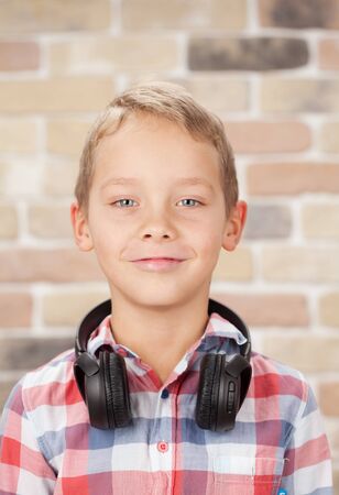 Young boy listening to music with headphonesの写真素材