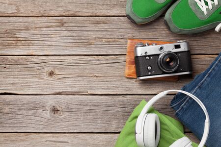 Clothing and accessories. Sneakers, jeans and camera. Urban outfit for everyday or travel vacation...