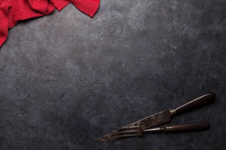Kitchen table with utensils, tablecloth and space for your recipe or menu. Top view flat layの写真素材
