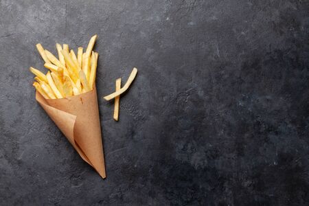 French crispy potato fries. Top view with copy space