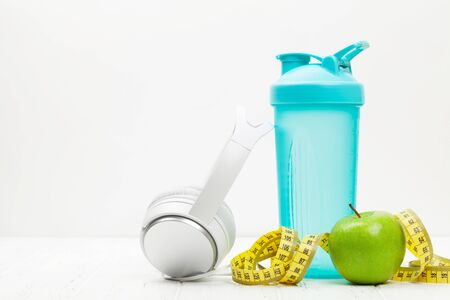 Healthy lifestyle, fitness and sport concept. Workout equipment and headphones. With copy space for your textの写真素材