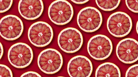 Grapefruit citrus slices seamless backdrop texture. Flat lay backdropの写真素材