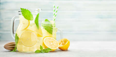 Mason jar and jug with lemon and mint homemade lemonade. With copy spaceの写真素材
